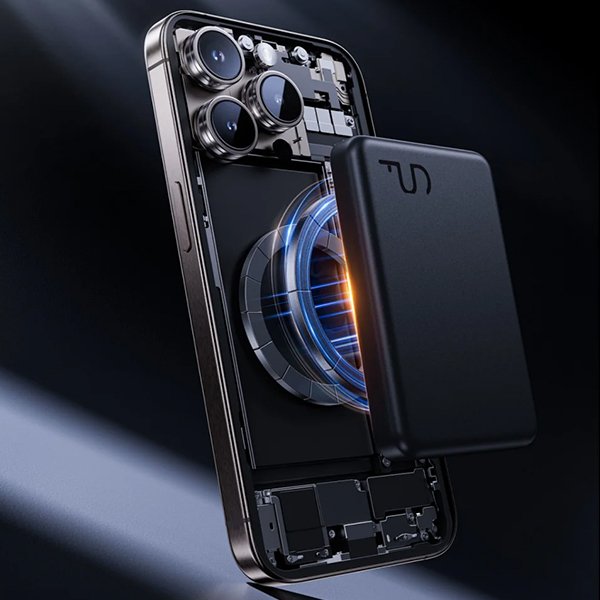Power bank magnetically connected to a phone, transparent blue energy shows Magsafe magnet at work, demonstrating portable wireless charging