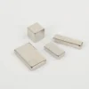 Pair of N52 neodymium magnets (square blocks, 10×10×10mm, nickel - plated) showcasing shape and finish.