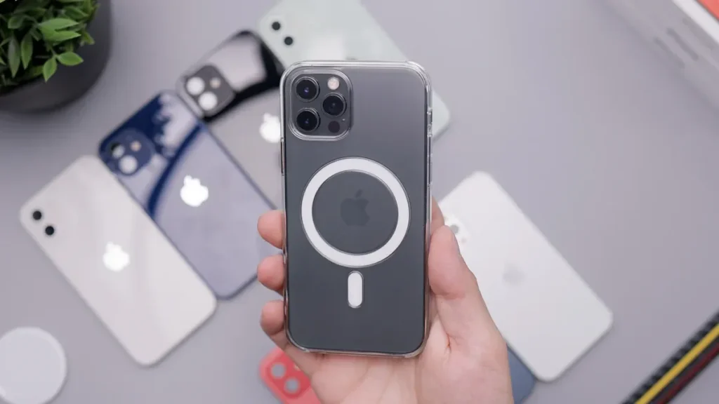 Hand holding an iPhone with a transparent MagSafe - compatible case, displaying the MagSafe magnets' attachment area.