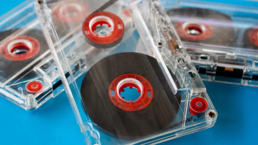 Transparent cassette tapes showcasing internal bar magnet application in audio technology