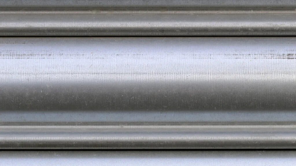 Silver metallic tubing, exploring "is aluminium magnetic material" via texture.