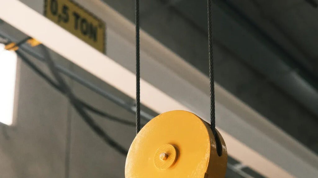 Industrial crane hook exemplifying bar magnet heavy - duty application