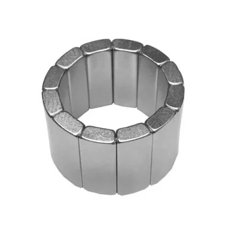 Assembly of neodymium block magnets in arc shape for motor magnet integration, showcasing nickel coating.