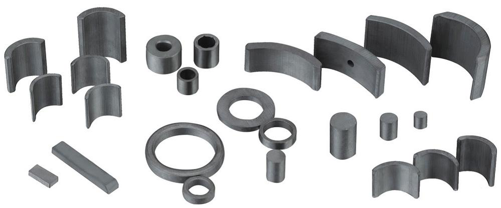 A set of ferrite magnets of different grades, sizes, and shapes laid out to highlight selection factors