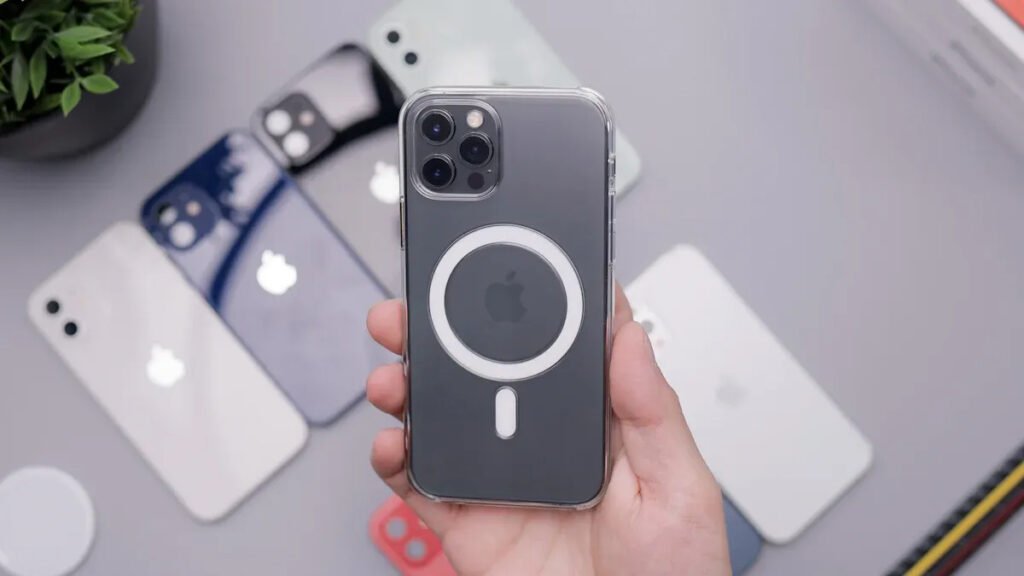 Hand holding an iPhone with a clear case featuring a visible MagSafe magnet ring