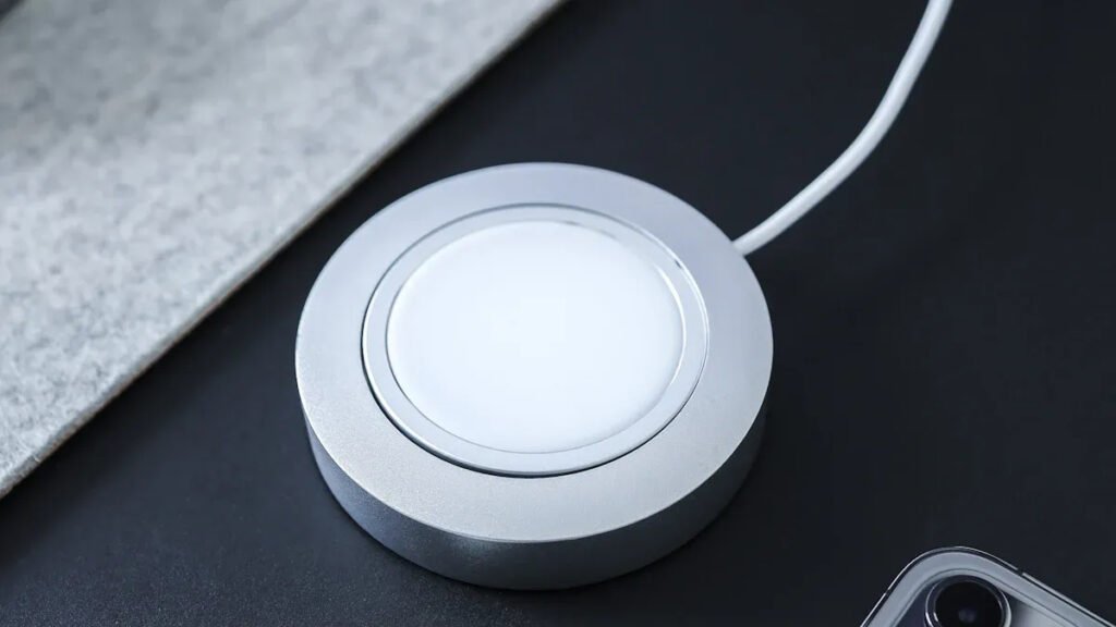 Close - up of a MagSafe wireless charger, highlighting its magnetic charging surface