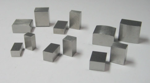 Display of metallic samples of Alnico magnets in multiple geometric shapes