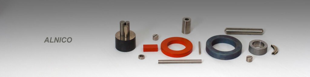Assorted alnico magnet components with "ALNICO" branding and metallic finishes